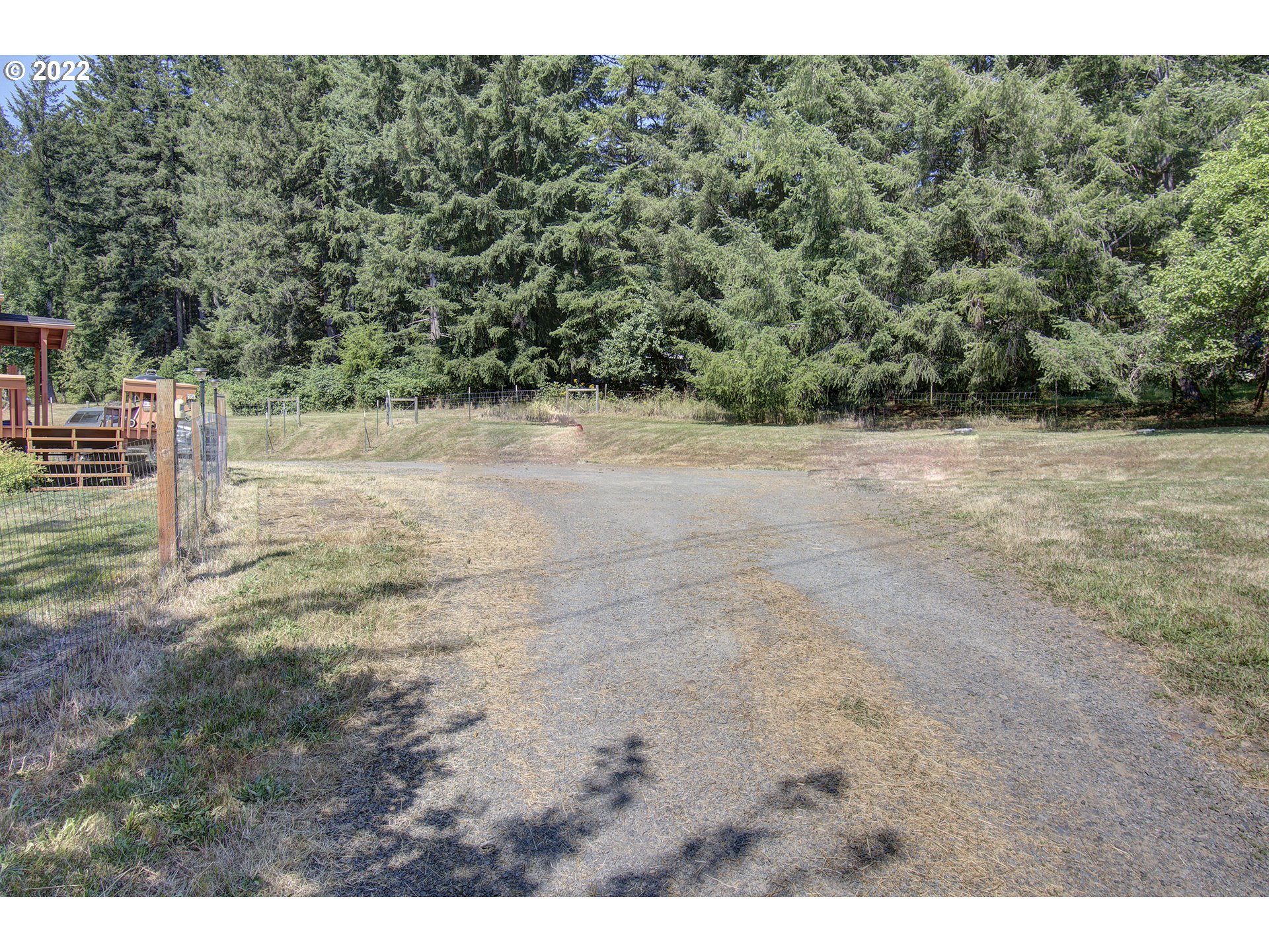 24416 Northeast Berry Road Battle Ground, WA 98604 - Photo 3 of 31 a view of a yard with an outdoor space