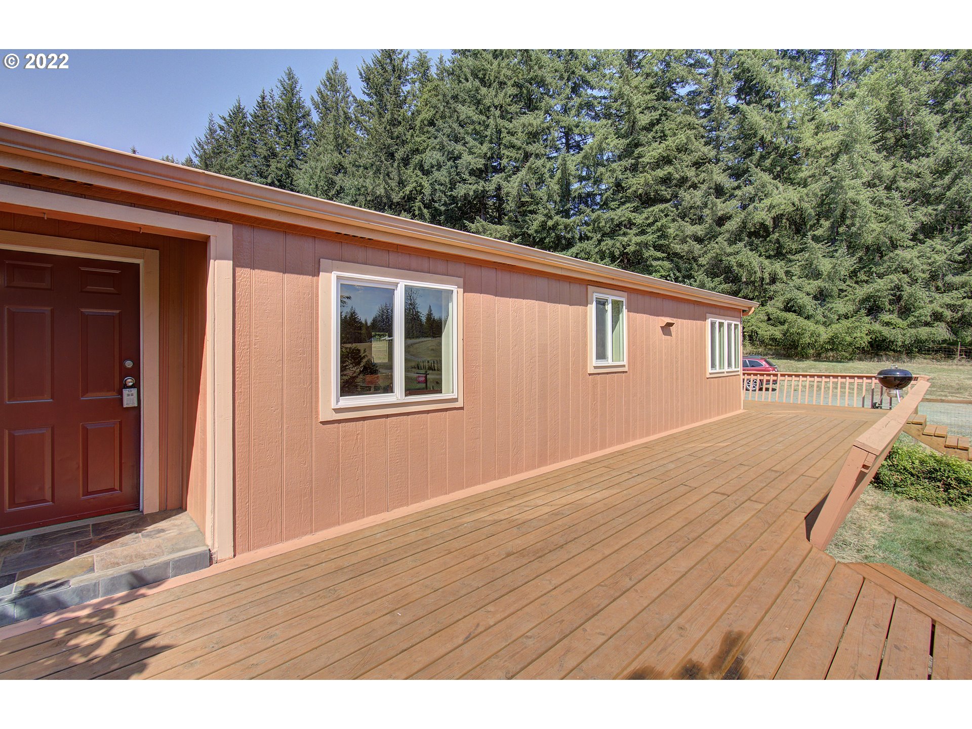 24416 Northeast Berry Road Battle Ground, WA 98604 - Photo 31 of 31 a view of a house with a outdoor space
