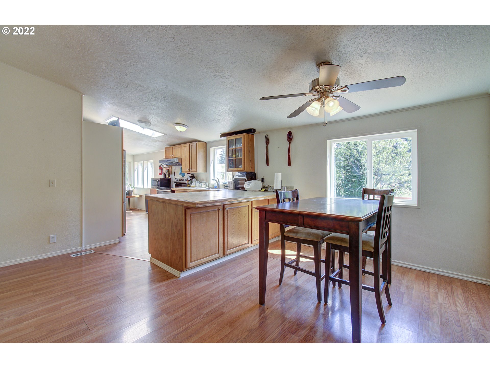 24416 Northeast Berry Road Battle Ground, WA 98604 - Photo 5 of 31 a dining room with furniture and wooden floor