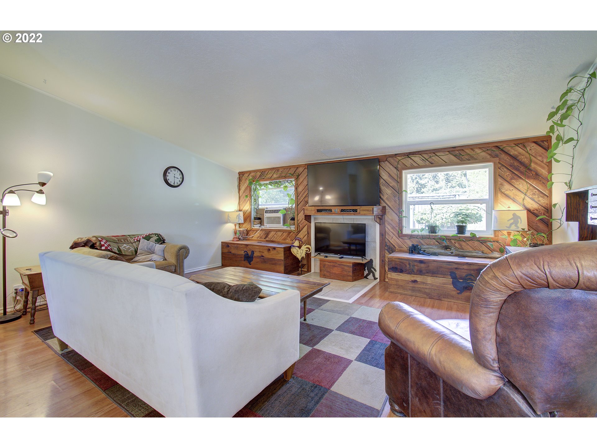 24416 Northeast Berry Road Battle Ground, WA 98604 - Photo 7 of 31 a living room with furniture and a flat screen tv