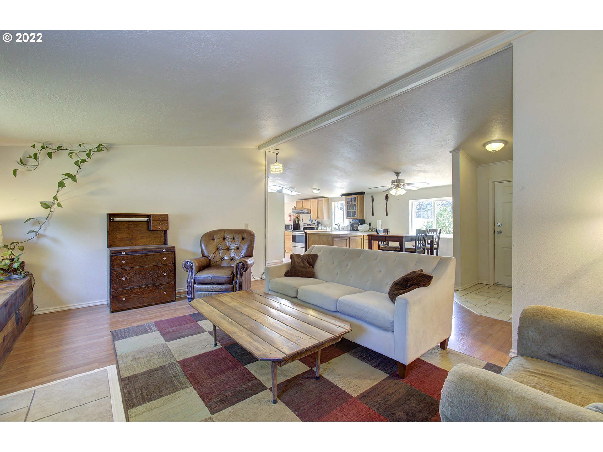 24416 Northeast Berry Road Battle Ground, WA 98604 - Photo 8 of 31 a living room with furniture and a wooden floor
