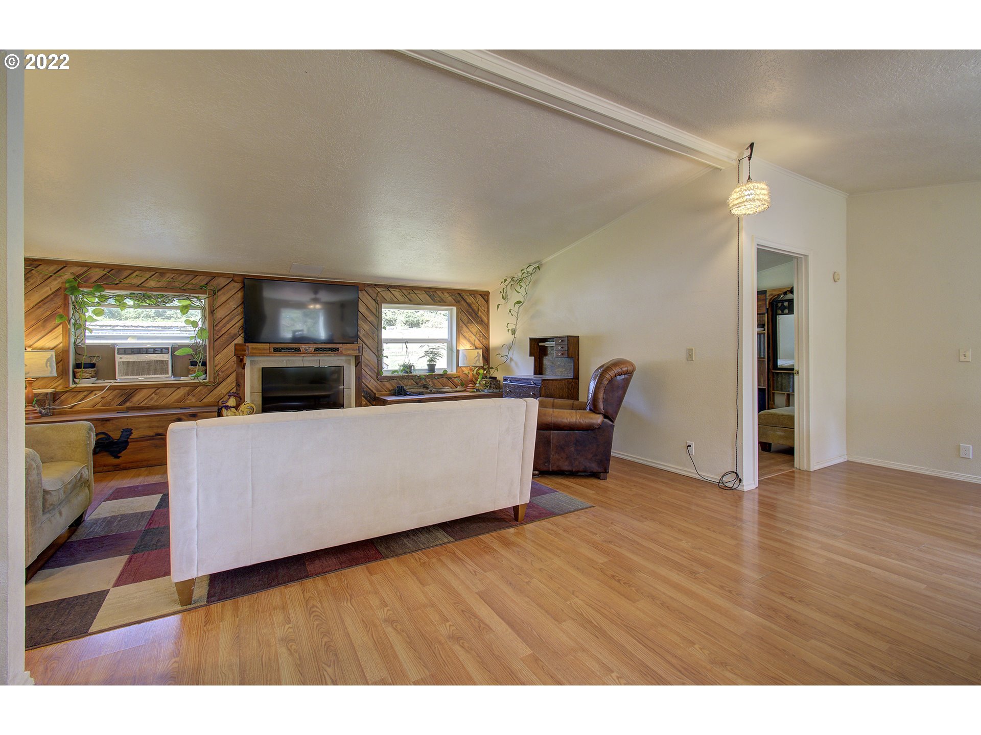 24416 Northeast Berry Road Battle Ground, WA 98604 - Photo 9 of 31 a living room with furniture and a flat screen tv