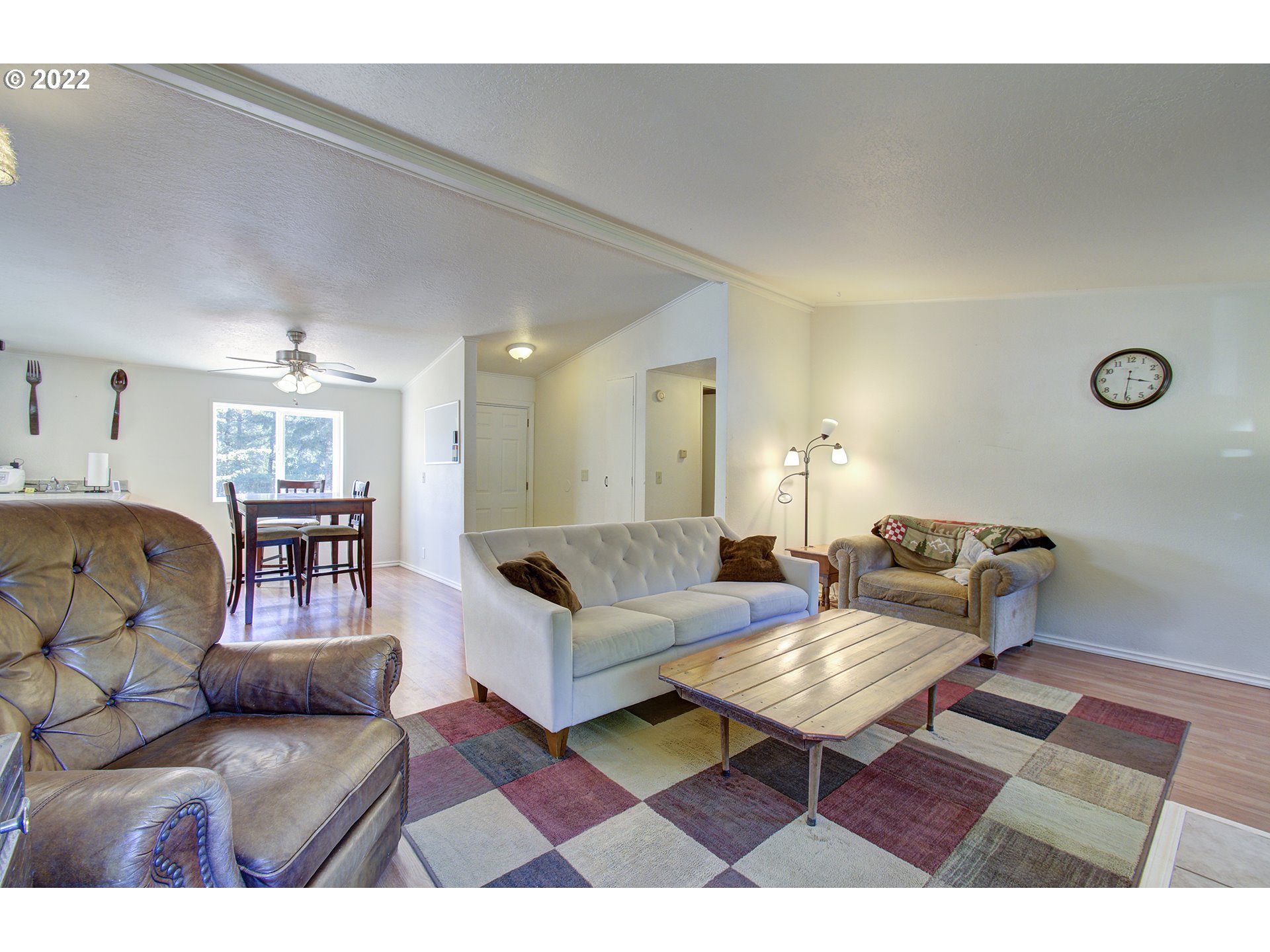 24416 Northeast Berry Road Battle Ground, WA 98604 - Photo 10 of 31 a living room with furniture and wooden floor
