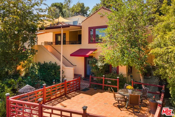 a backyard of a house with seating space