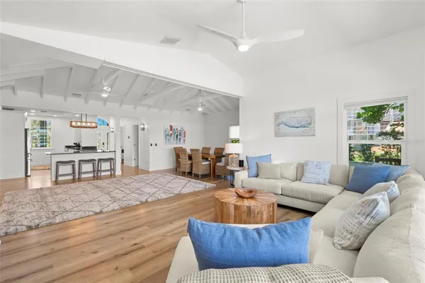 a view of a chairs and table in patio with a yard