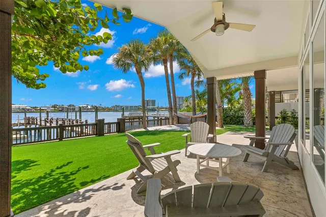 a view of a balcony with wooden floor and outdoor seating