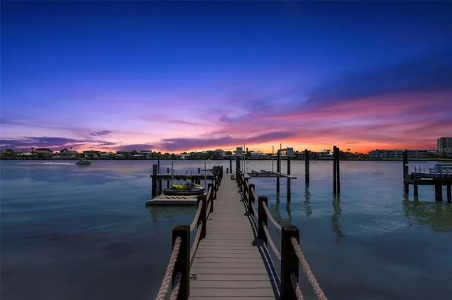 a view of a house with a swimming pool and a big yard