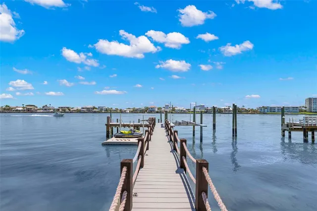 a bedroom with a large bed and a tv