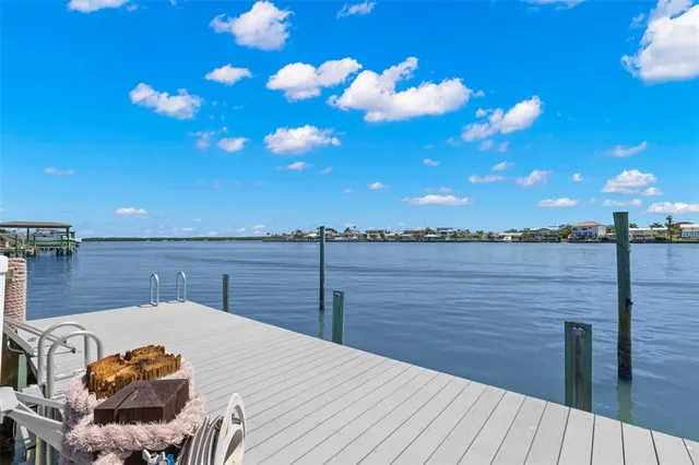 a spacious bedroom with a bed and a window