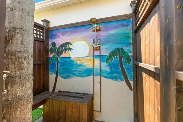 a bathroom with a granite countertop sink and a window