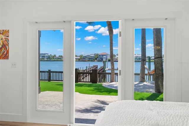 a view of living room with furniture and floor to ceiling window