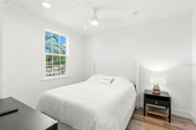 a bathroom with a granite countertop toilet a sink and a mirror