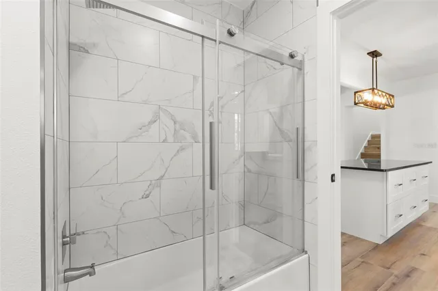 a picture of a bathroom with a shower