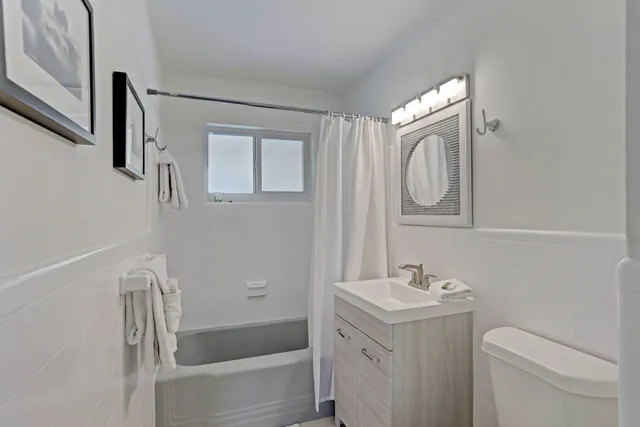 a bathroom with a sink a toilet and a bathtub