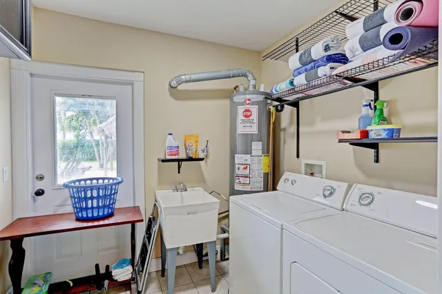 a view of a room that has a table and a chair in it