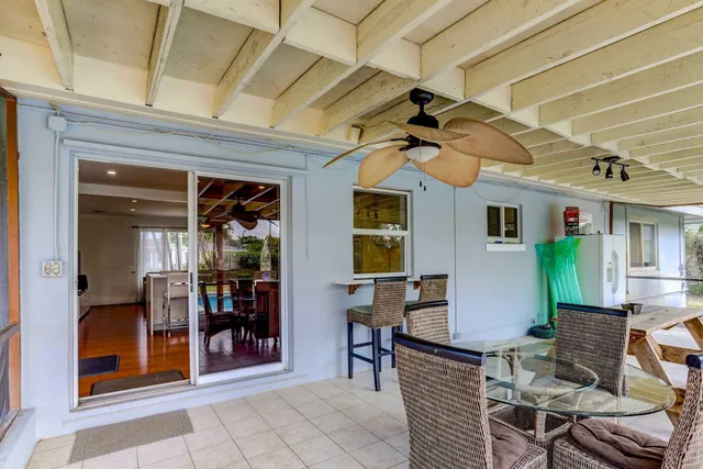 a view of a chairs and tables in the room