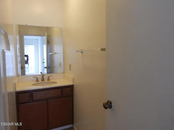a bathroom with a sink and mirror