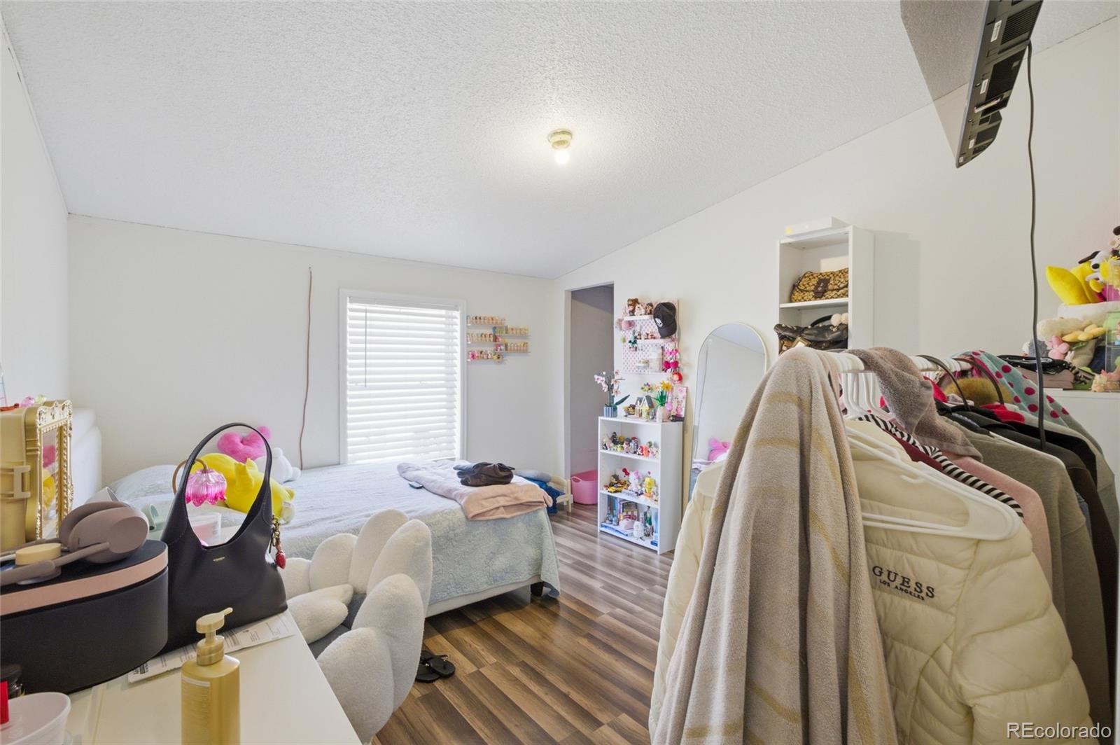 1724 Clark Street Aurora, CO 80011 - Photo 12 of 19 a bed room with a bed and a window