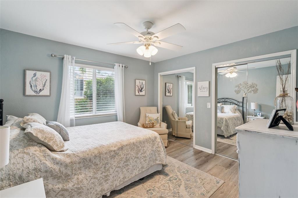 75 Calumet Avenue Ponce Inlet, FL 32127 - Photo 11 of 35 a bedroom with a bed and a large mirror with a dresser