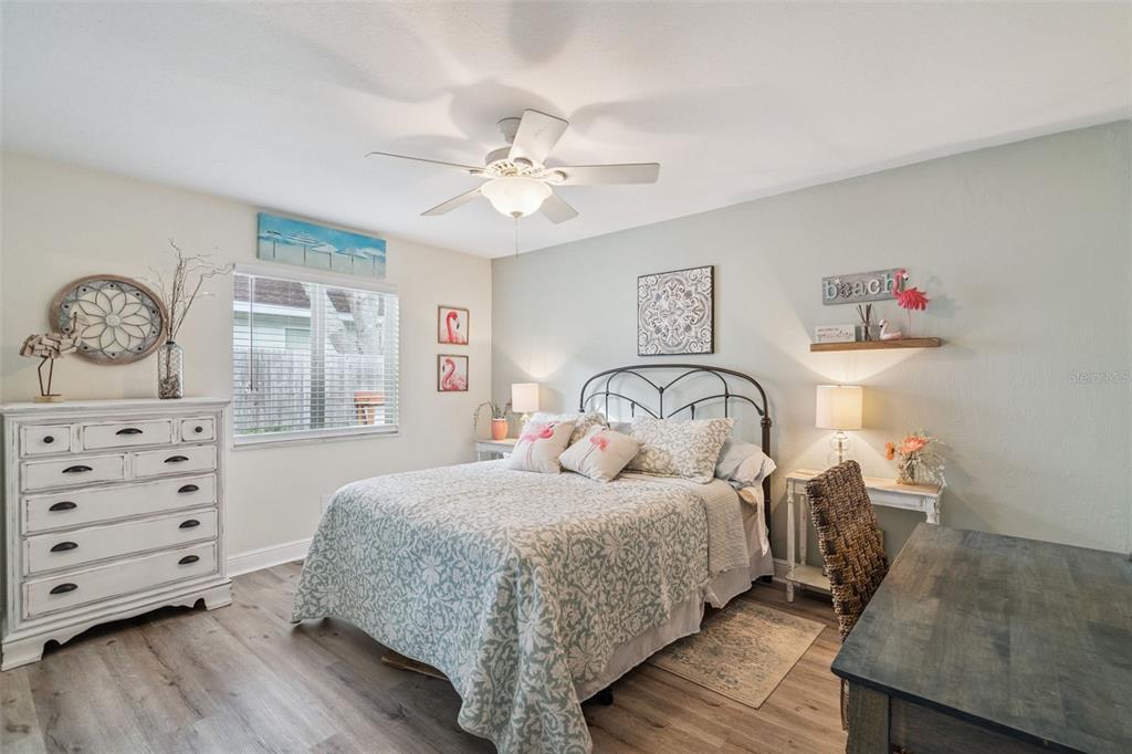 75 Calumet Avenue Ponce Inlet, FL 32127 - Photo 12 of 35 a bedroom with a bed and wooden floor