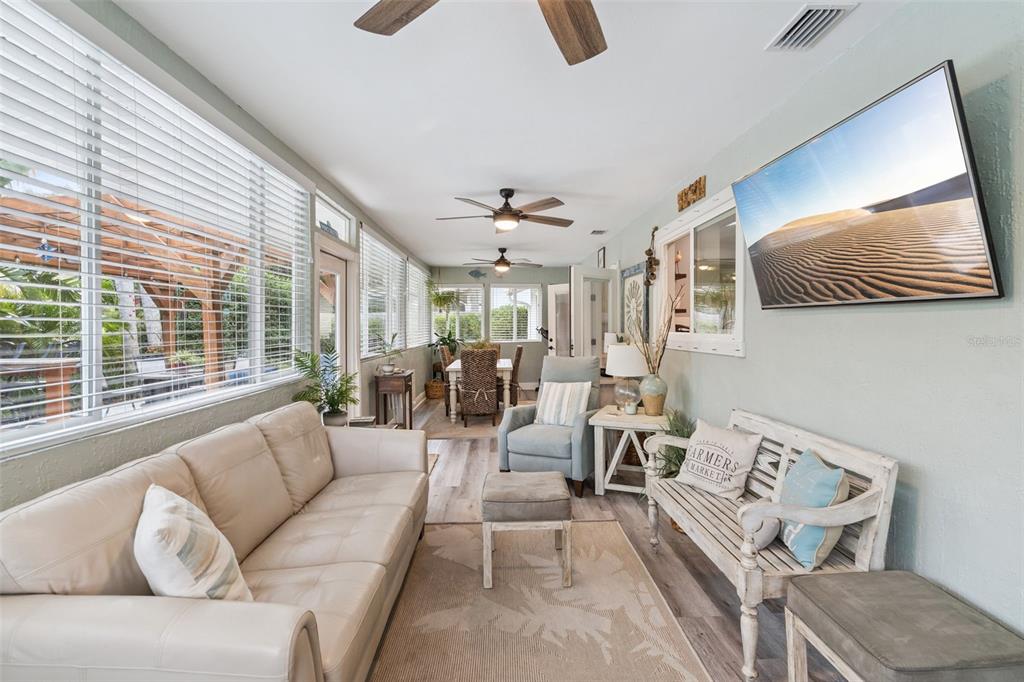 75 Calumet Avenue Ponce Inlet, FL 32127 - Photo 18 of 35 a living room with furniture and a large window
