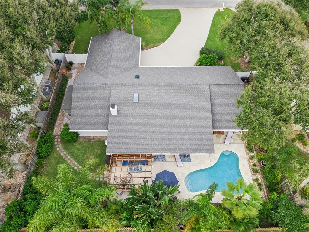 75 Calumet Avenue Ponce Inlet, FL 32127 - Photo 32 of 35 an aerial view of a house with a yard and trees all around