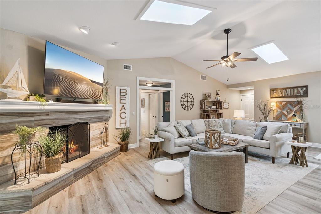 75 Calumet Avenue Ponce Inlet, FL 32127 - Photo 5 of 35 a living room with furniture and a fireplace