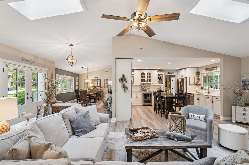 75 Calumet Avenue Ponce Inlet, FL 32127 - Photo 6 of 35 a living room with furniture kitchen view and a chandelier