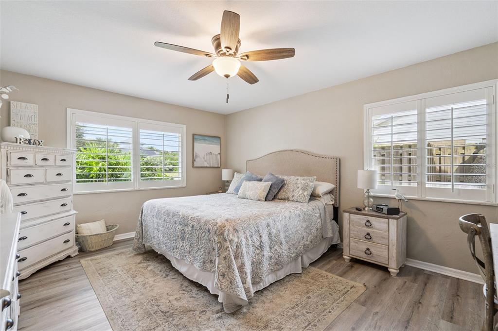 75 Calumet Avenue Ponce Inlet, FL 32127 - Photo 10 of 35 a bedroom with a large bed and a window