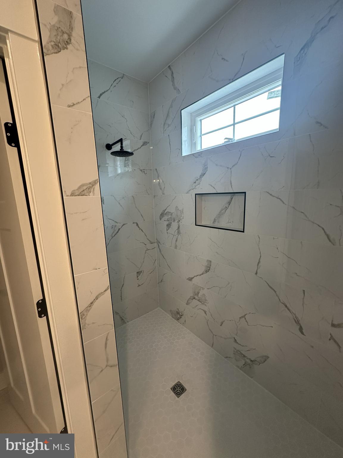 19426 Parsons Road Georgetown, DE 19947 - Photo 13 of 18 a bathroom with a sink and a shower