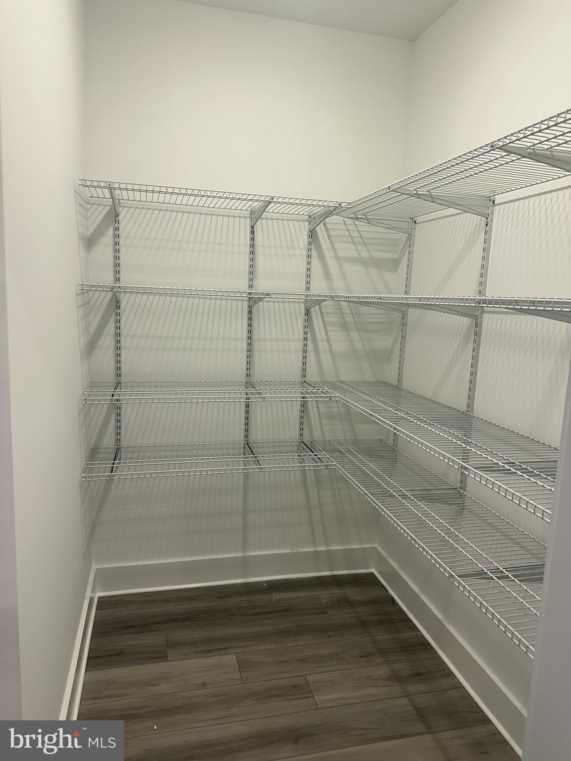 19426 Parsons Road Georgetown, DE 19947 - Photo 16 of 18 a empty room with wooden floor