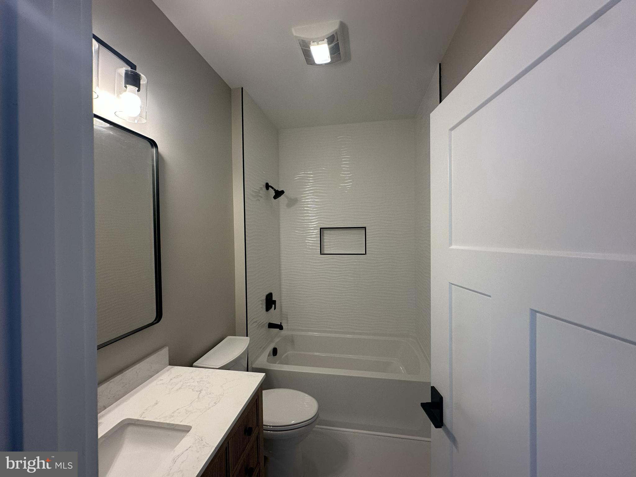 19426 Parsons Road Georgetown, DE 19947 - Photo 17 of 18 a bathroom with a sink a toilet and shower