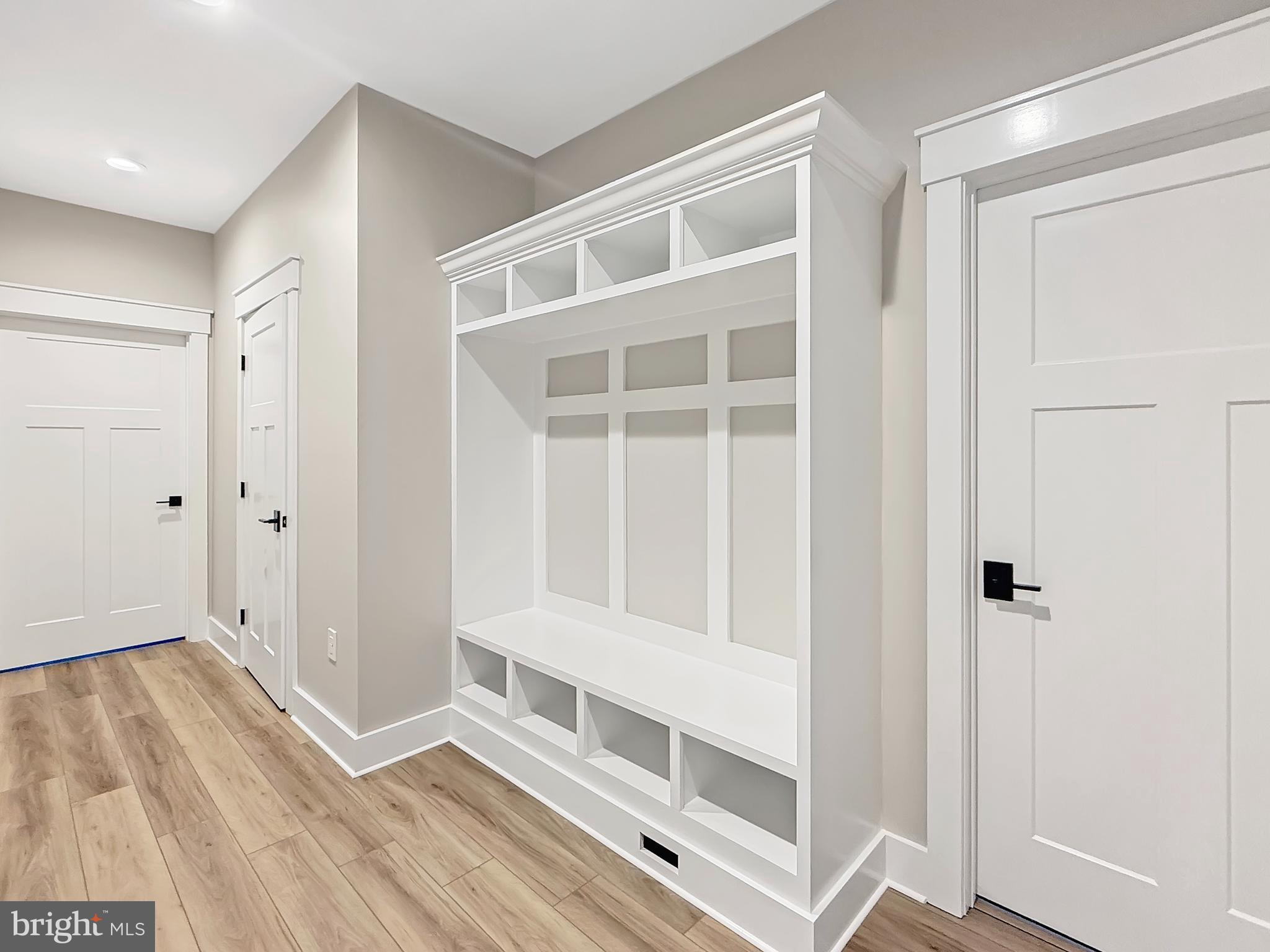 19426 Parsons Road Georgetown, DE 19947 - Photo 7 of 18 a view of an empty room with wooden floor and a window