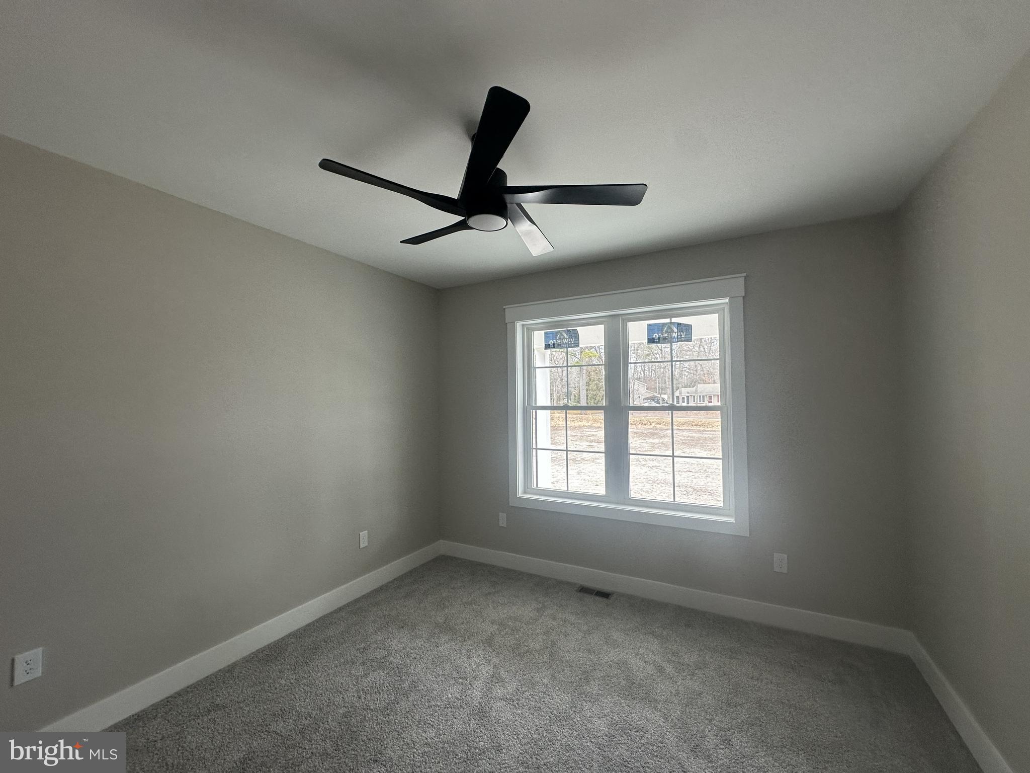 19426 Parsons Road Georgetown, DE 19947 - Photo 10 of 18 a view of a livingroom with a ceiling fan and window