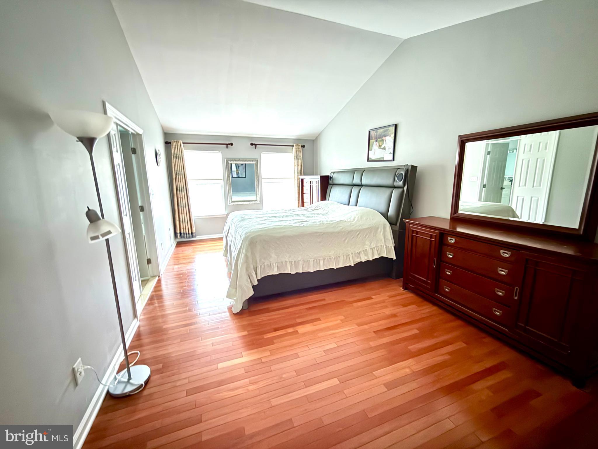15 Coburn Road Pennington, NJ 08534 - Photo 11 of 30 a bedroom with a bed and wooden floor