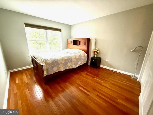 15 Coburn Road Pennington, NJ 08534 - Photo 12 of 30 a bedroom with a bed and wooden floor