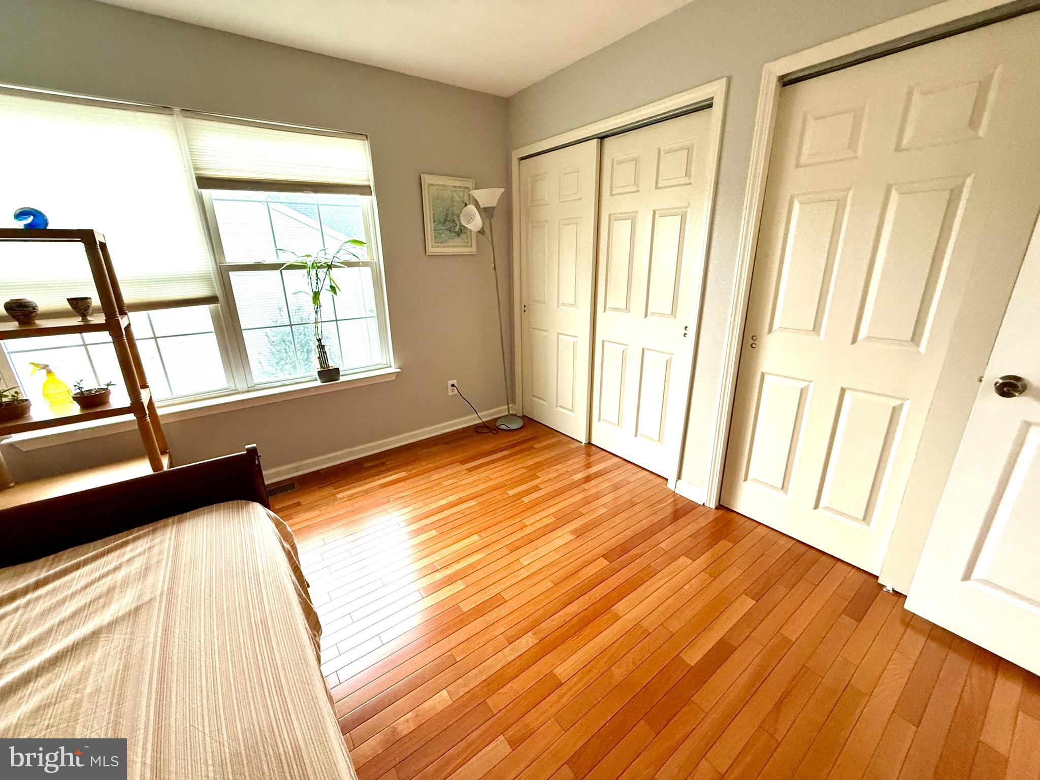 15 Coburn Road Pennington, NJ 08534 - Photo 13 of 30 a view of an empty room with wooden floor and a window