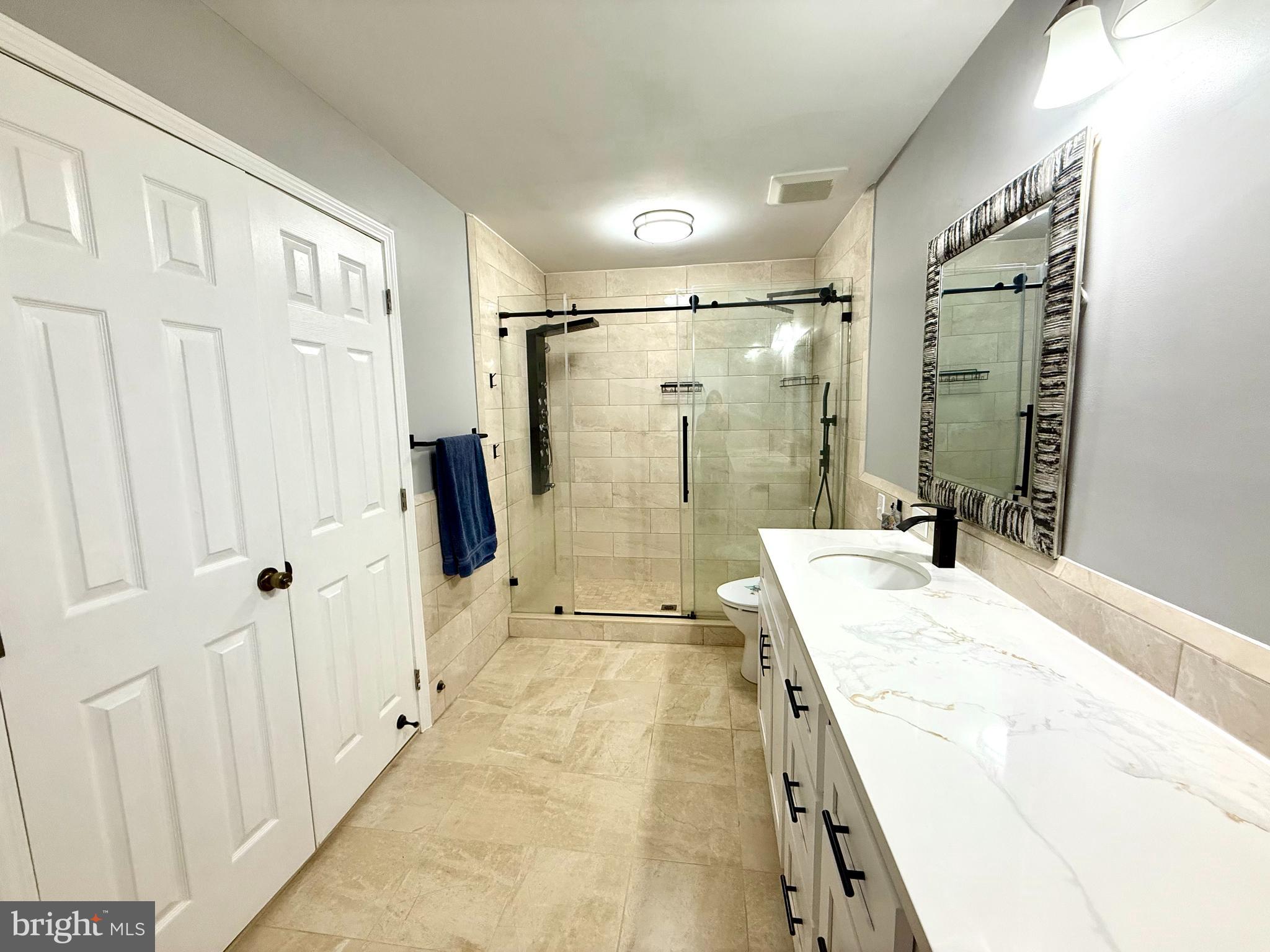 15 Coburn Road Pennington, NJ 08534 - Photo 15 of 30 a bathroom with a granite countertop sink mirror shower and a bathtub