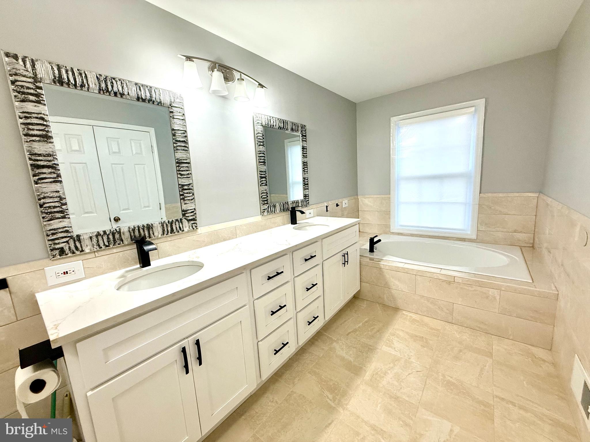 15 Coburn Road Pennington, NJ 08534 - Photo 16 of 30 a spacious bathroom with sinks mirror and a bathtub