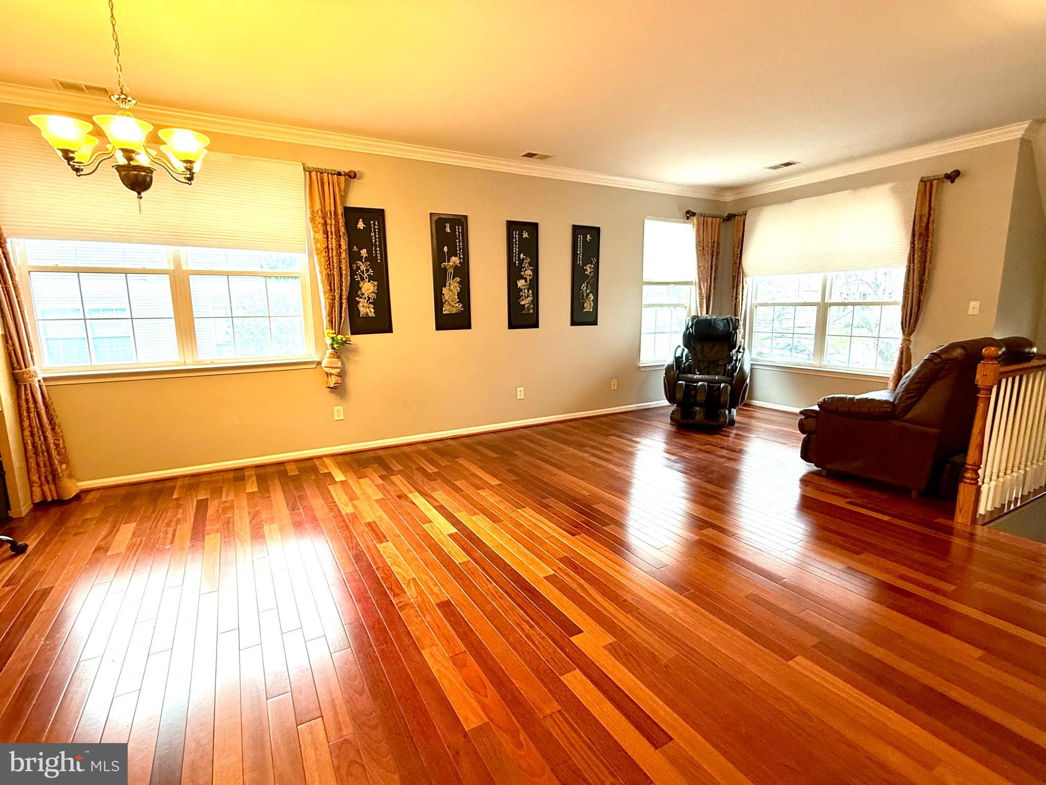 15 Coburn Road Pennington, NJ 08534 - Photo 3 of 30 a view of an empty room with wooden floor and a window