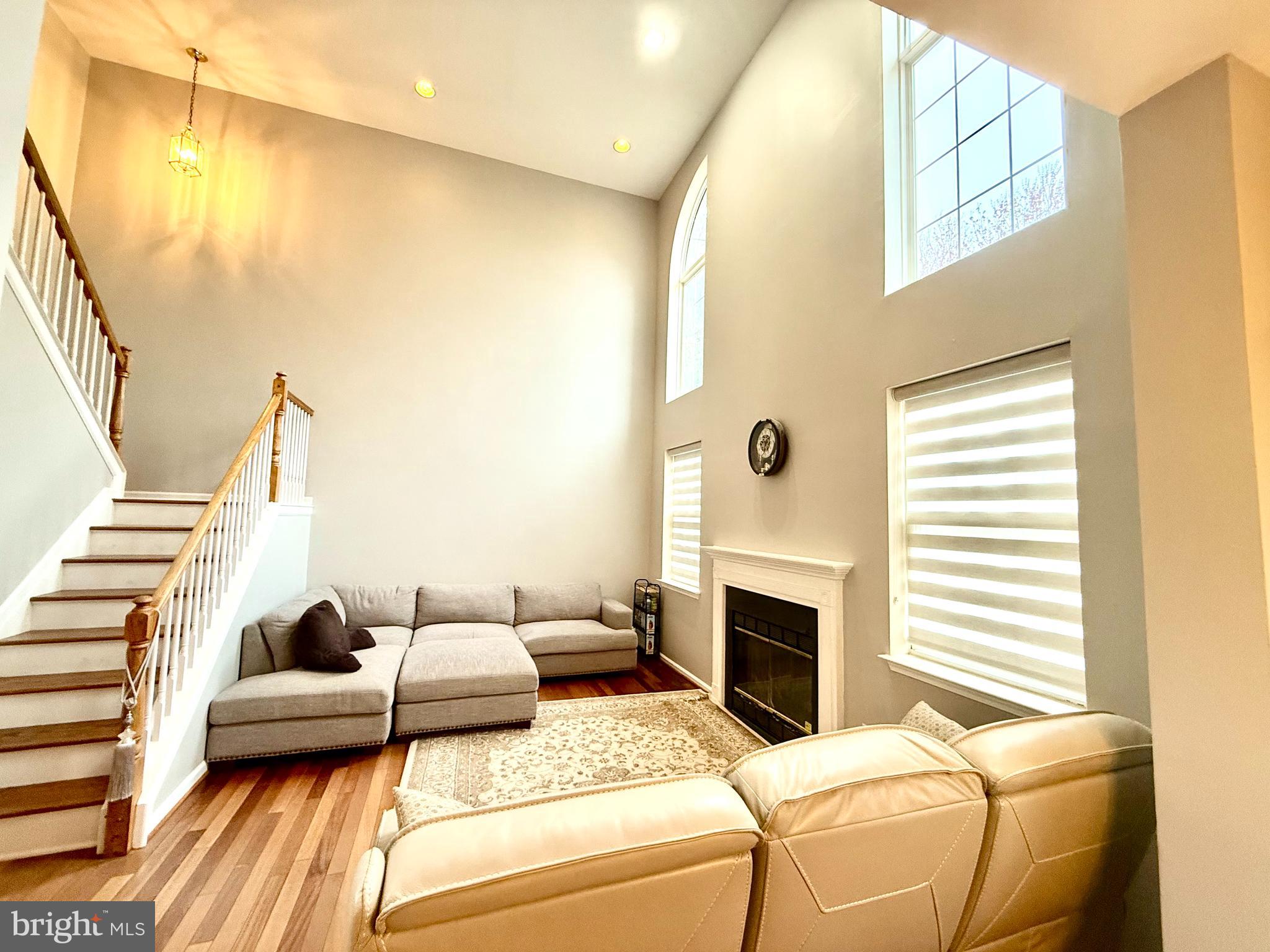 15 Coburn Road Pennington, NJ 08534 - Photo 4 of 30 a bedroom with furniture and a fireplace