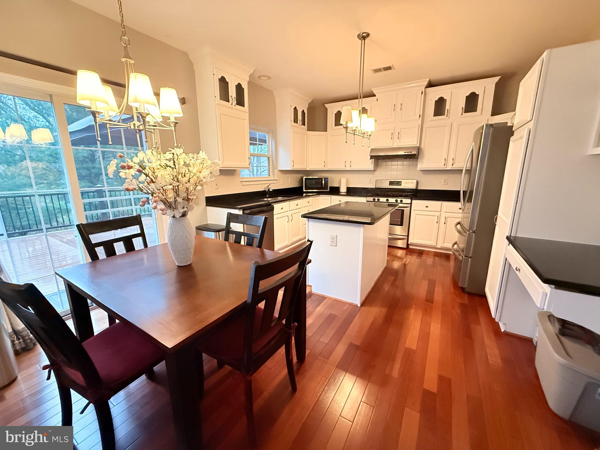 15 Coburn Road Pennington, NJ 08534 - Photo 6 of 30 a view of a dining room with furniture window and wooden floor