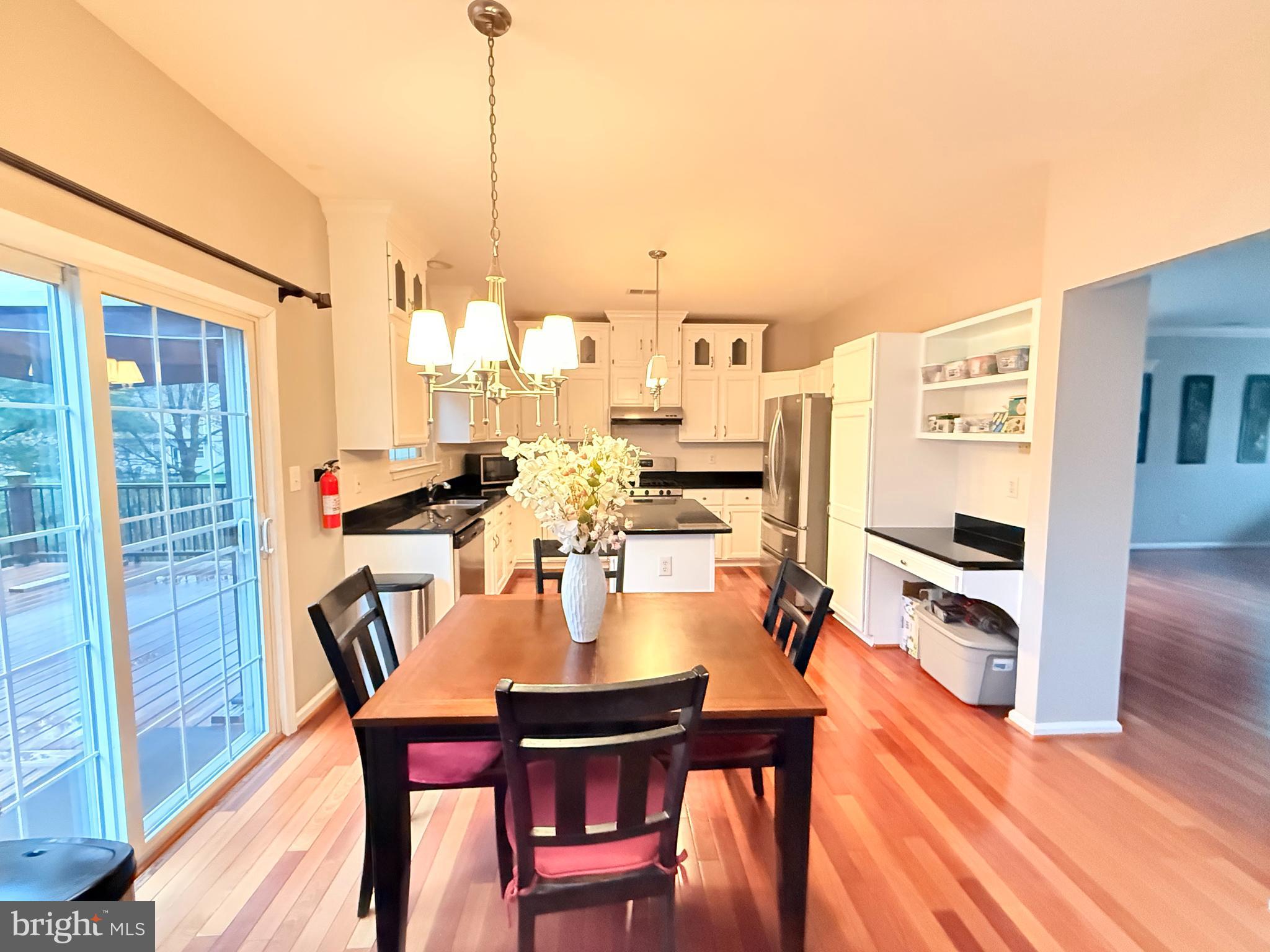 15 Coburn Road Pennington, NJ 08534 - Photo 7 of 30 a dining table with chairs and wooden floor