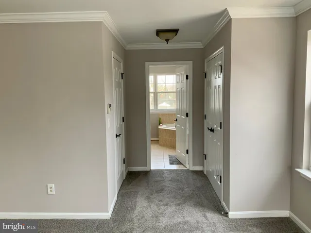 a bedroom with a bed and a chair