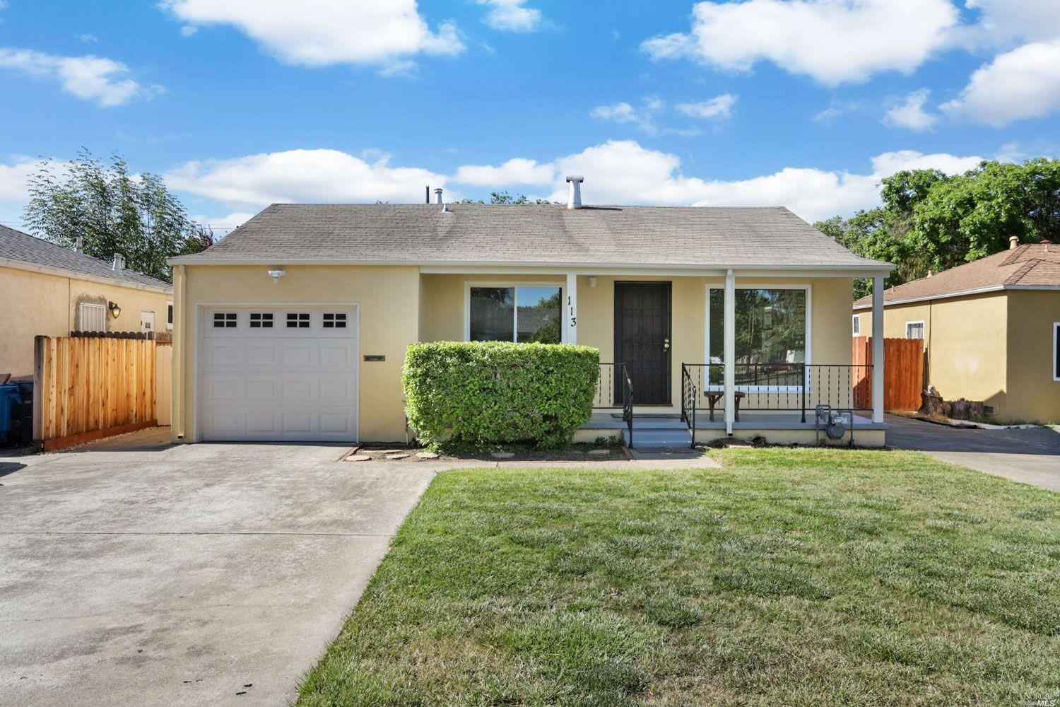 a view of a house with sitting area and garden