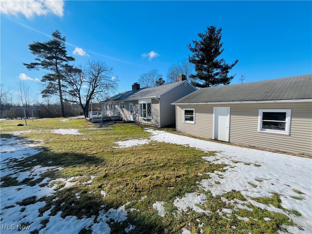 3210 Austinburg Road Ashtabula, OH 44004 - Photo 11 of 48 Snow covered property featuring a lawn