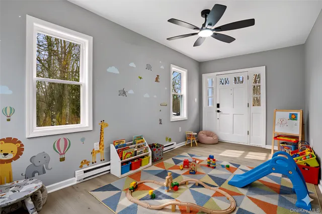 a bed room with furniture and paintings on the wall
