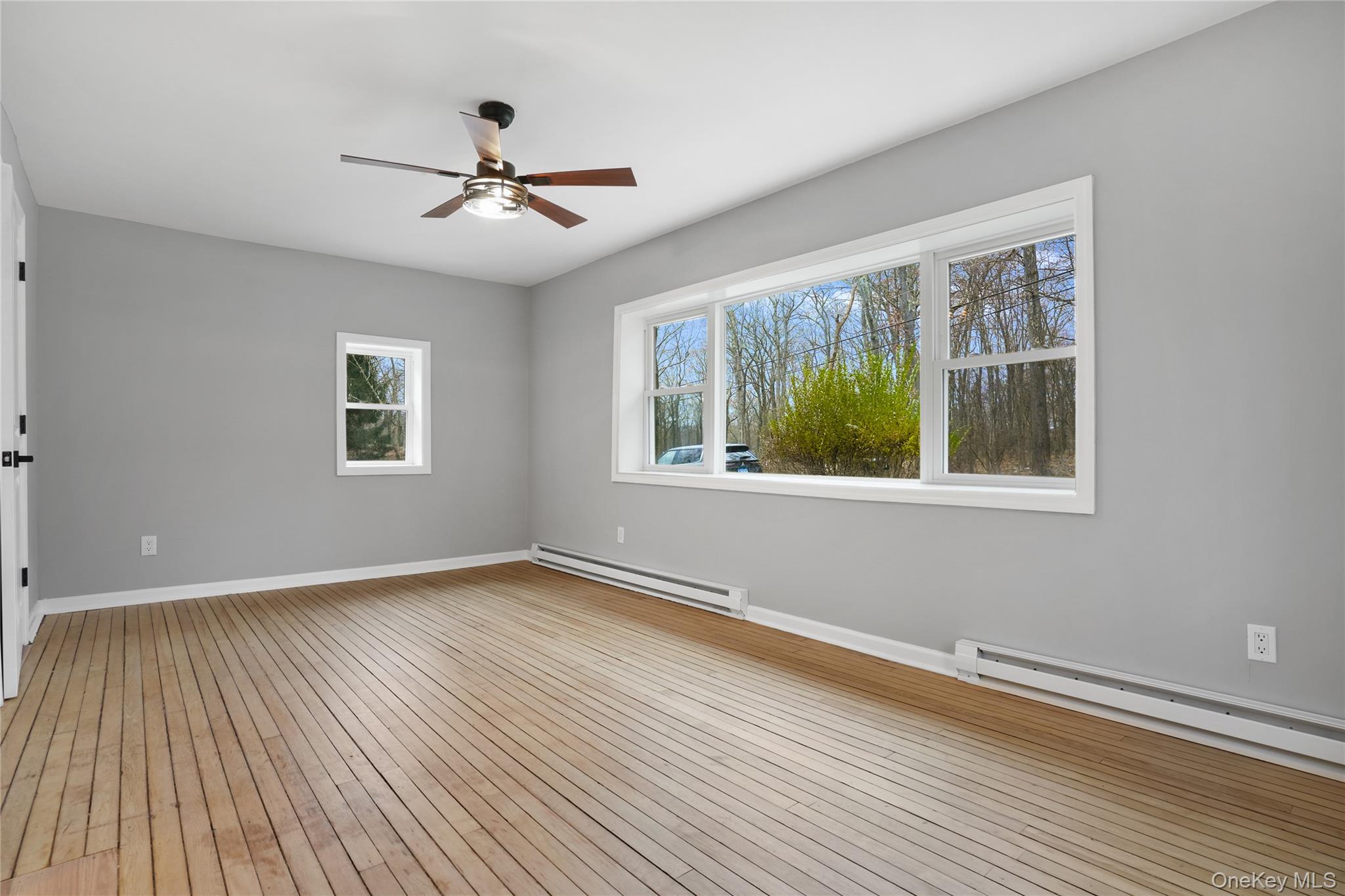 517 East Mountain Road North, Unit 515517 Cold Spring, NY 10516 - Photo 13 of 25 a view of an empty room with wooden floor and a window