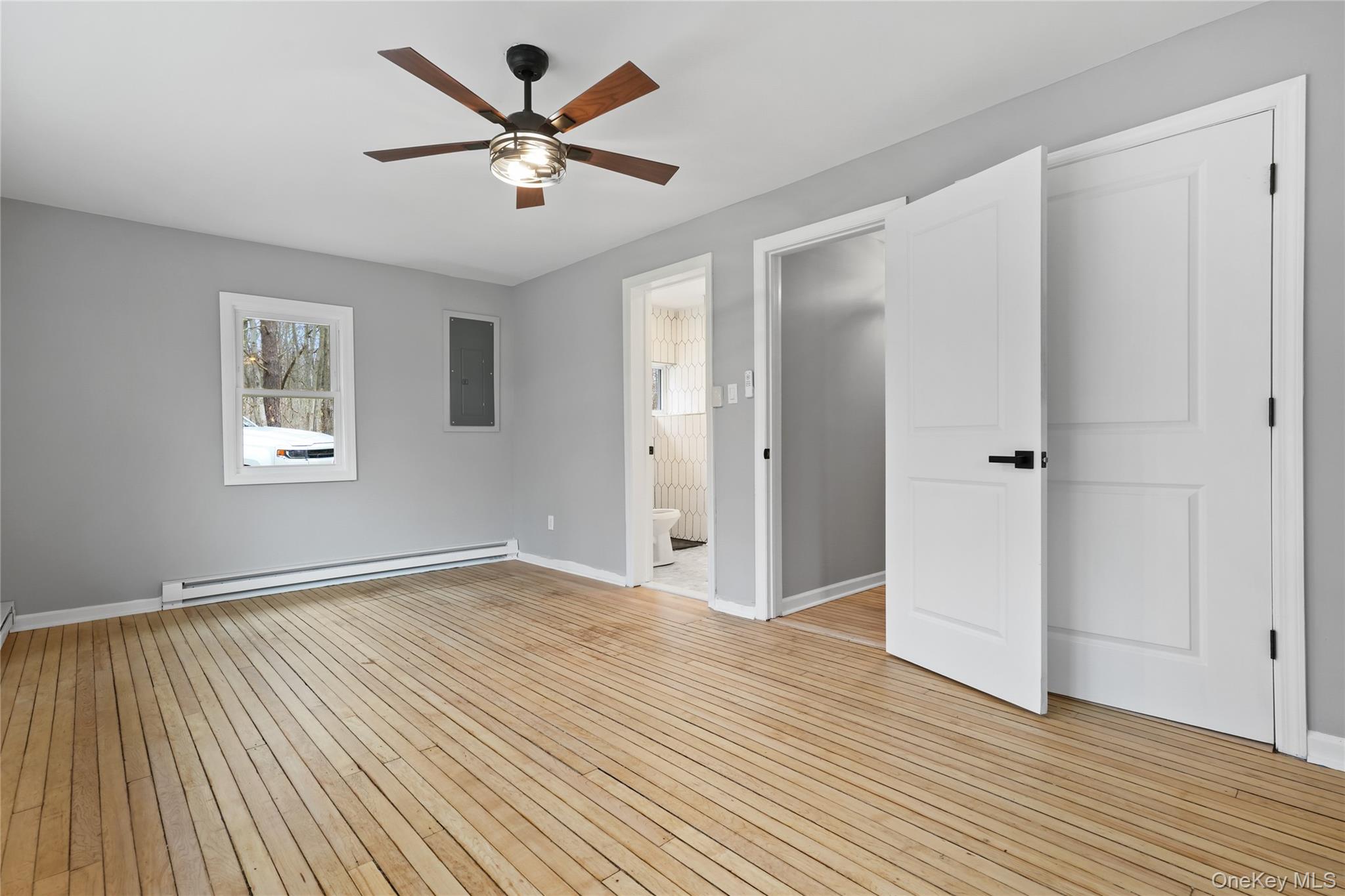 517 East Mountain Road North, Unit 515517 Cold Spring, NY 10516 - Photo 16 of 30 an empty room with wooden floor and windows
