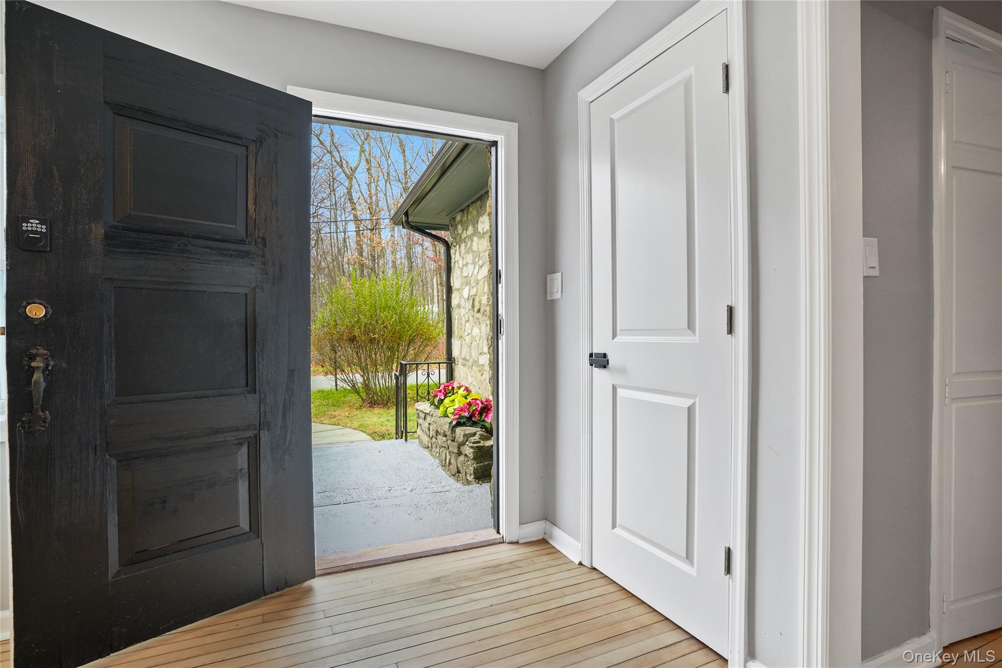 517 East Mountain Road North, Unit 515517 Cold Spring, NY 10516 - Photo 2 of 25 a view of a hallway with wooden floor and windows